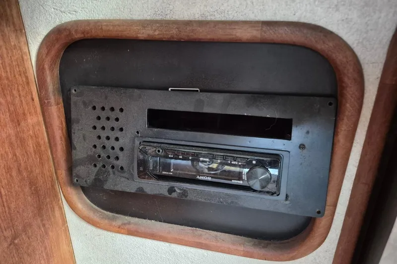 Slide: The Image of 1991 Carver 36 Aft Cabin Motor Yacht stereo system with wooden frame. - 20