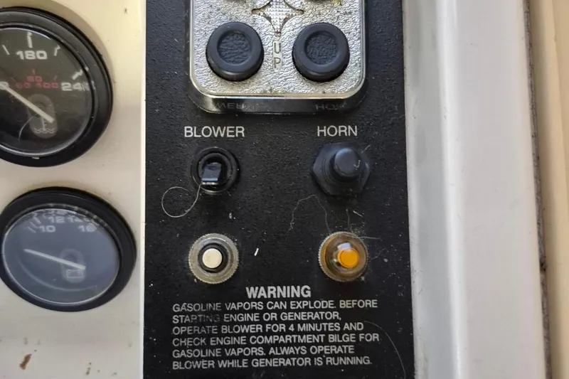 Slide: The Image of Control panel of a 1991 Carver 36 Aft Cabin Motor Yacht with blower and horn switches. - 22