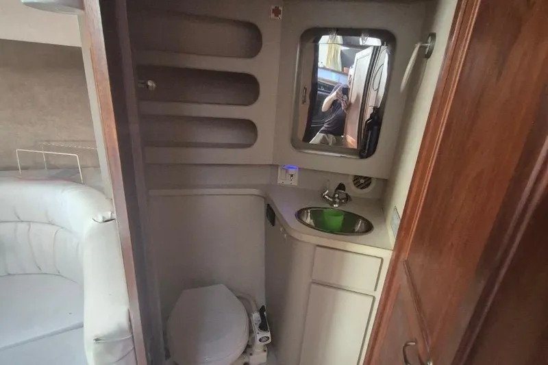 Slide: The Image of Interior of 1991 Carver 36 Aft Cabin Motor Yacht bathroom with sink and toilet. - 27