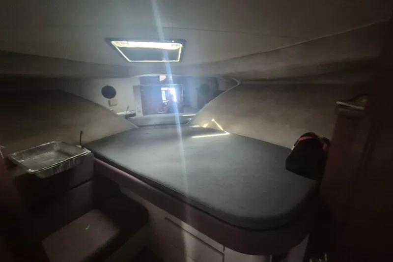 Slide: The Image of 1991 Carver 36 Aft Cabin Motor Yacht interior cabin with bed and storage. - 28