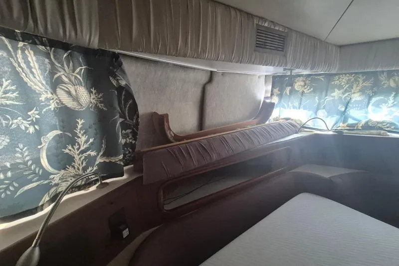 Slide: The Image of Interior cabin of 1991 Carver 36 Aft Cabin Motor Yacht with floral curtains. - 37