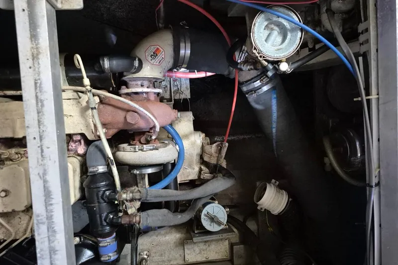 Slide: The Image of Engine compartment of 1991 Carver 36 Aft Cabin Motor Yacht, showing various mechanical components. - 39