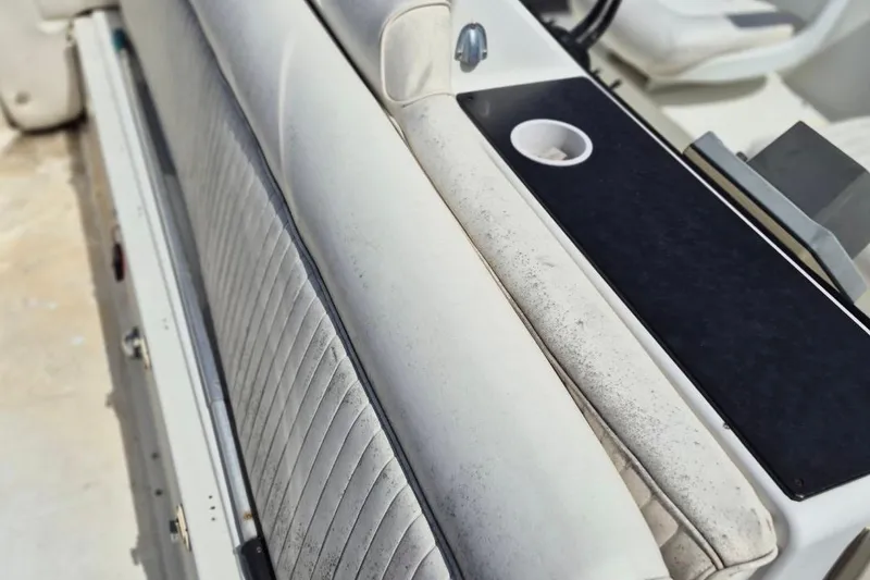 Slide: The Image of 1991 Carver 36 Aft Cabin Motor Yacht interior seating with cup holder detail. - 7