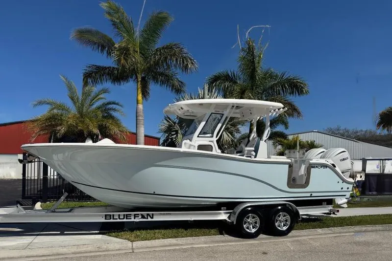 The Image of 2025 Sea Fox 288 Commander boat on trailer, surrounded by palm trees. - 0