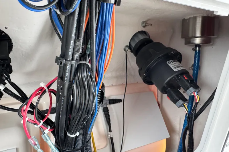 Slide: The Image of Electrical wiring and components inside a 2025 Sea Fox 288 Commander boat. - 100