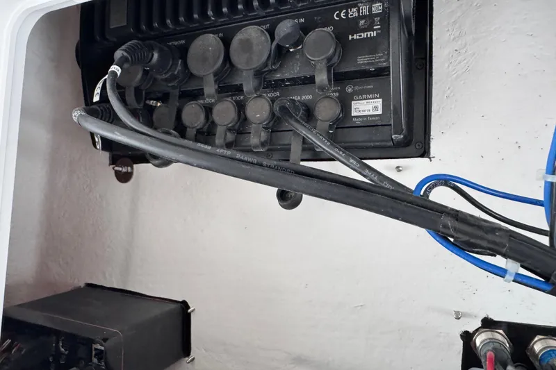 Slide: The Image of Electrical panel with cables on a 2025 Sea Fox 288 Commander boat. - 101