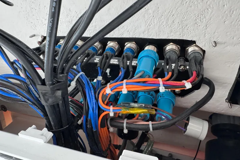 Slide: The Image of Wiring and connectors inside a 2025 Sea Fox 288 Commander boat. - 102
