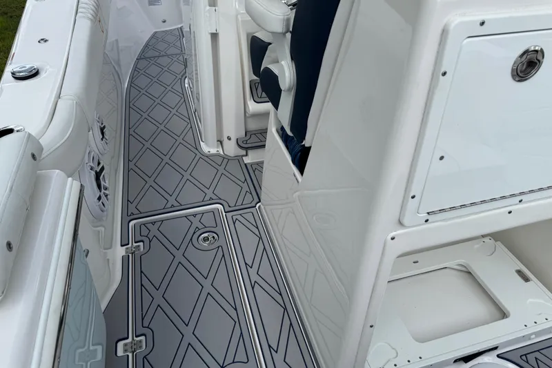 Slide: The Image of 2025 Sea Fox 288 Commander boat interior with sleek, modern flooring and storage compartments. - 109