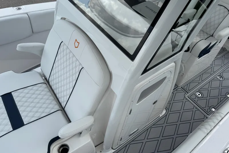 Slide: The Image of 2025 Sea Fox 288 Commander interior with white quilted seats and sleek design. - 116