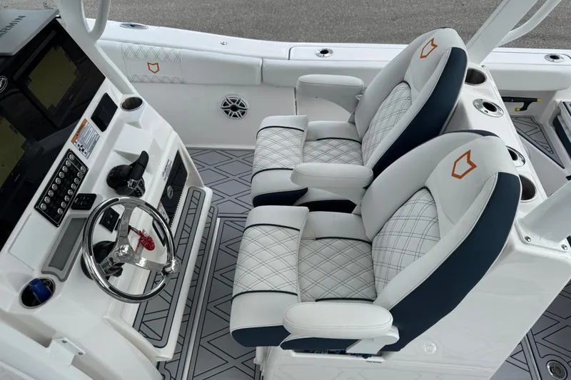 Slide: The Image of 2025 Sea Fox 288 Commander boat interior with dual captain's chairs and modern dashboard. - 118