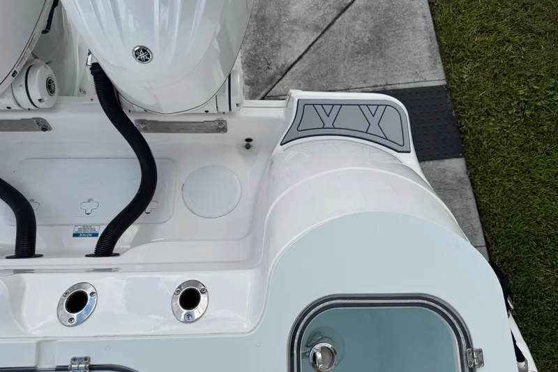 Slide: The Image of 2025 Sea Fox 288 Commander boat stern with dual engines and deck details. - 123