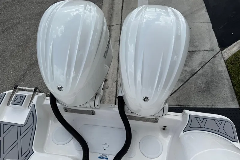 Slide: The Image of 2025 Sea Fox 288 Commander with dual outboard engines, viewed from above. - 124