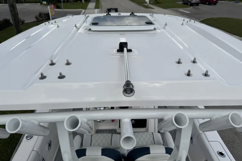 Slide: The Image of 2025 Sea Fox 288 Commander boat roof with rod holders and hatch. - 125
