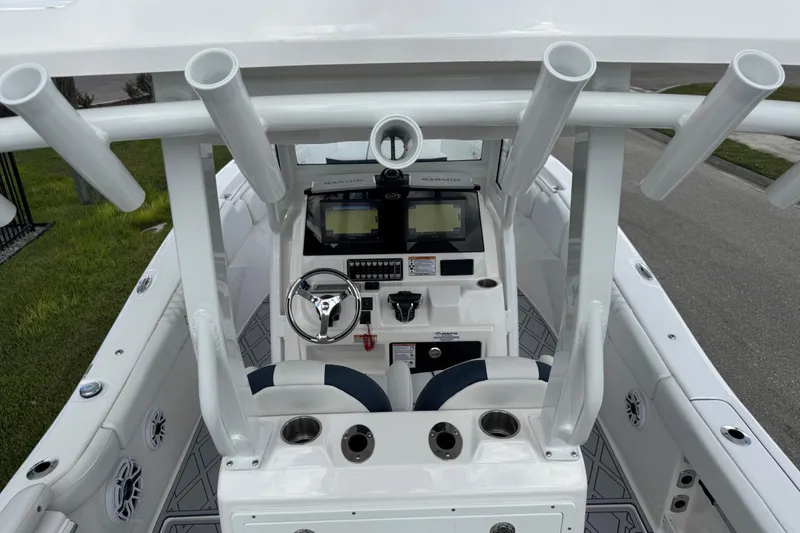 Slide: The Image of 2025 Sea Fox 288 Commander boat cockpit with steering wheel and navigation screens. - 126