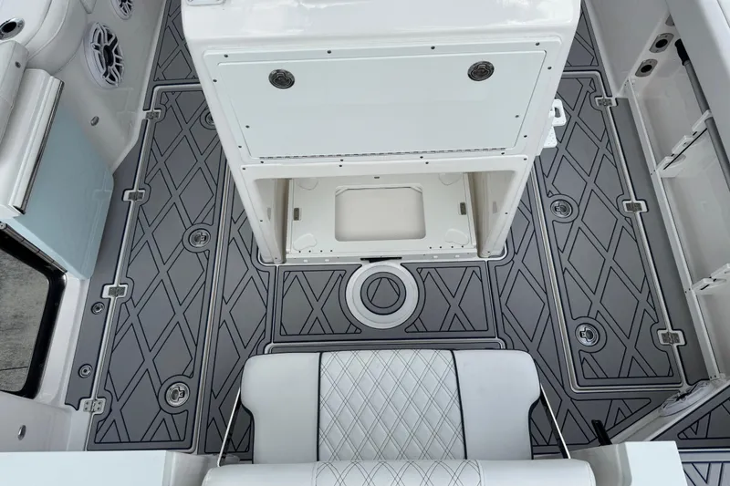 Slide: The Image of 2025 Sea Fox 288 Commander boat interior with diamond-patterned flooring and seating. - 127