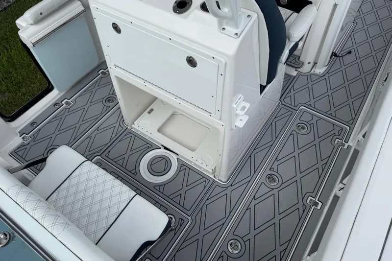 Slide: The Image of Interior view of 2025 Sea Fox 288 Commander boat, featuring stylish seating and patterned flooring. - 128