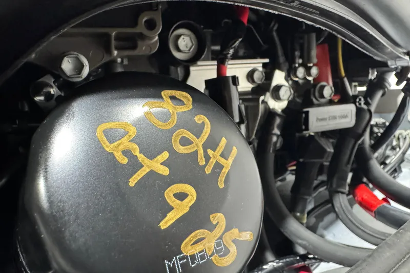 Slide: The Image of Engine compartment of 2025 Sea Fox 288 Commander with visible components and handwritten markings. - 135