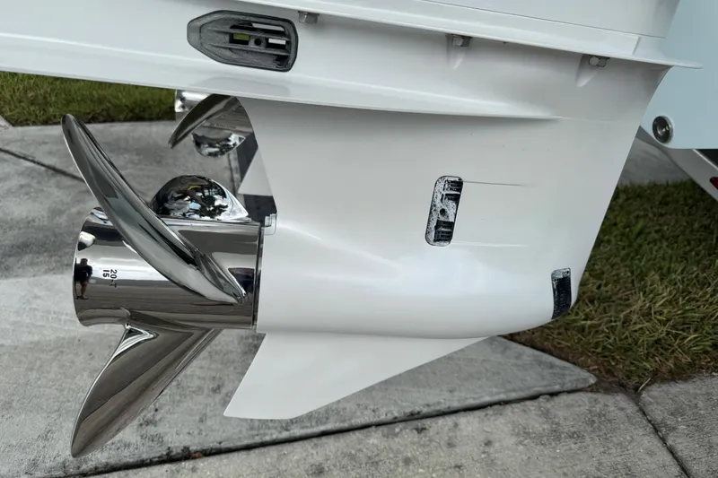 Slide: The Image of Close-up of a 2025 Sea Fox 288 Commander boat propeller on a concrete surface. - 14