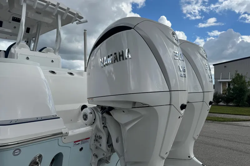 Slide: The Image of 2025 Sea Fox 288 Commander with dual Yamaha outboard engines, parked outdoors. - 18