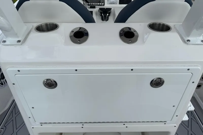 Slide: The Image of 2025 Sea Fox 288 Commander boat console with cup holders and storage compartments. - 30