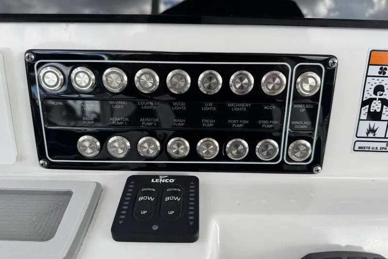 Slide: The Image of Control panel of 2025 Sea Fox 288 Commander boat with labeled switches and buttons. - 39