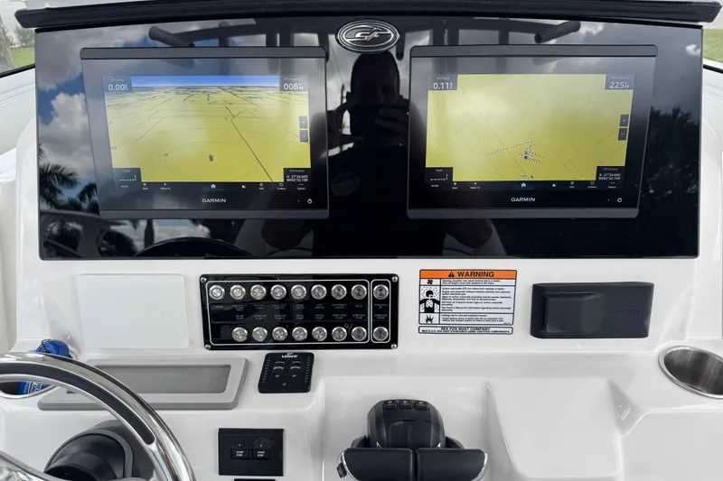 Slide: The Image of 2025 Sea Fox 288 Commander dashboard with dual Garmin navigation screens and control panel. - 42