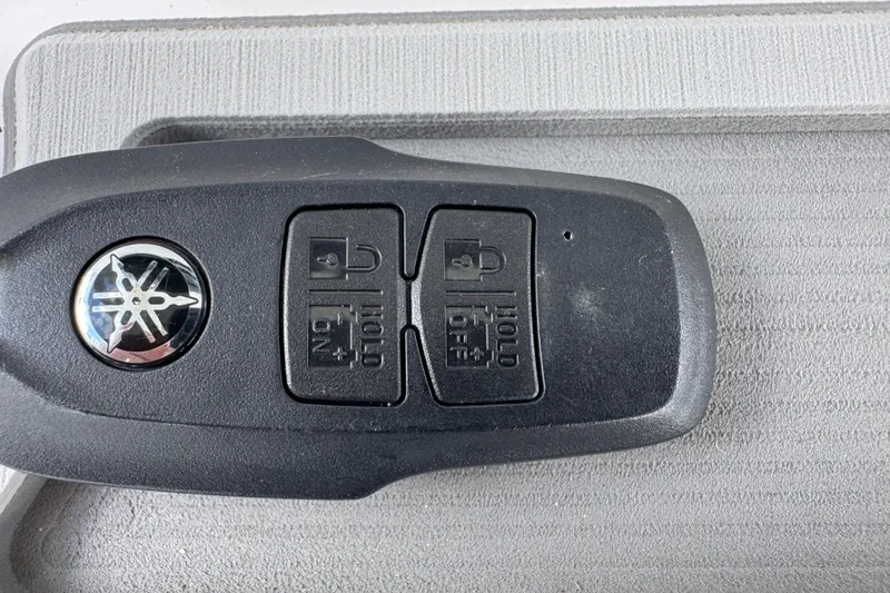 Slide: The Image of Key fob for 2025 Sea Fox 288 Commander boat on textured surface. - 47