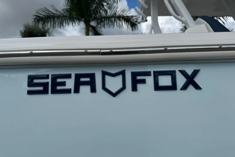Slide: The Image of 2025 Sea Fox 288 Commander boat logo with palm trees in the background. - 5