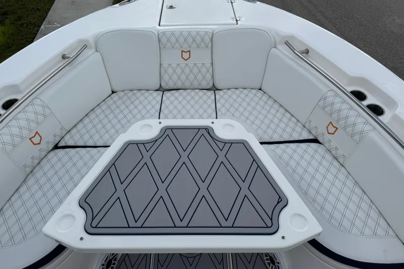 Slide: The Image of 2025 Sea Fox 288 Commander boat interior with diamond-patterned seating and table. - 50