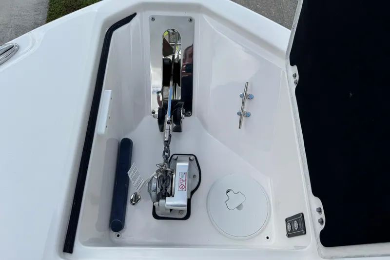 Slide: The Image of Anchor compartment of 2025 Sea Fox 288 Commander boat, featuring winch and cleat. - 55