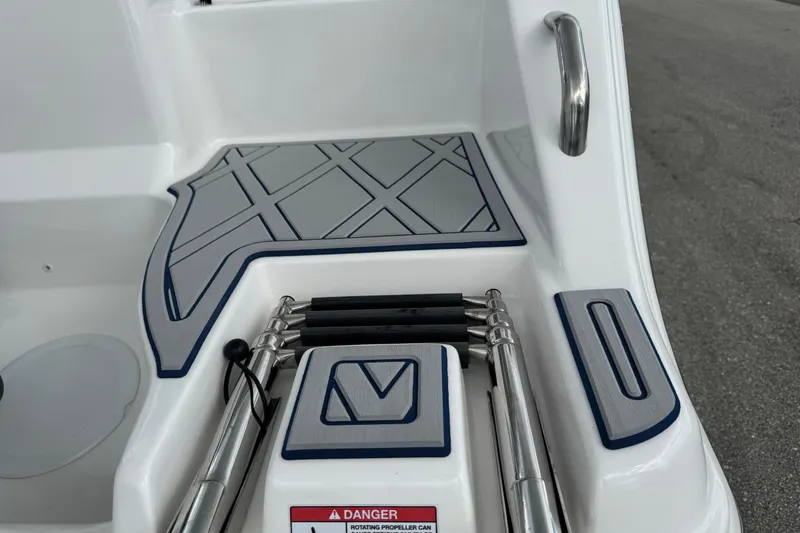 Slide: The Image of 2025 Sea Fox 288 Commander boat deck with ladder and safety warning. - 6