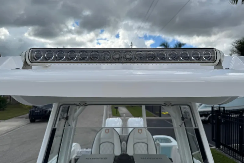 Slide: The Image of 2025 Sea Fox 288 Commander boat with LED light bar under cloudy sky. - 62