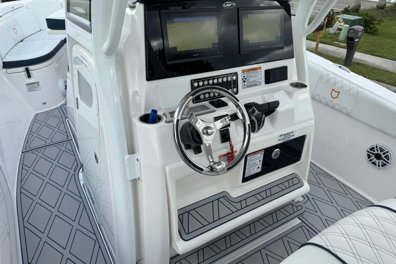 Slide: The Image of 2025 Sea Fox 288 Commander boat dashboard with dual screens and modern steering wheel. - 69