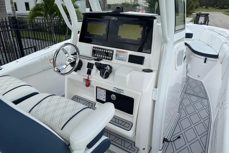 Slide: The Image of 2025 Sea Fox 288 Commander boat cockpit with dual screens and modern steering wheel. - 70