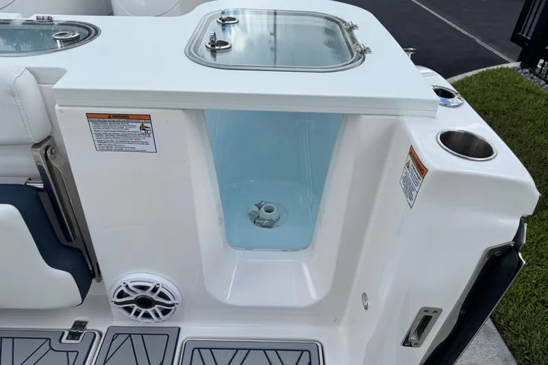 Slide: The Image of 2025 Sea Fox 288 Commander boat interior with storage compartment and speaker. - 76