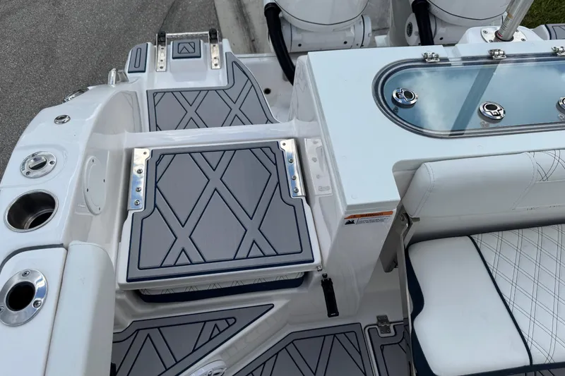 Slide: The Image of 2025 Sea Fox 288 Commander boat deck with seating and storage compartments. - 79