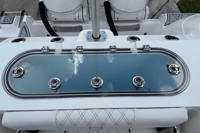 Slide: The Image of 2025 Sea Fox 288 Commander boat livewell with stainless steel fittings and cushioned seating. - 80