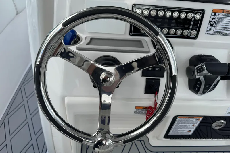 Slide: The Image of Steering wheel and controls of 2025 Sea Fox 288 Commander boat. - 85