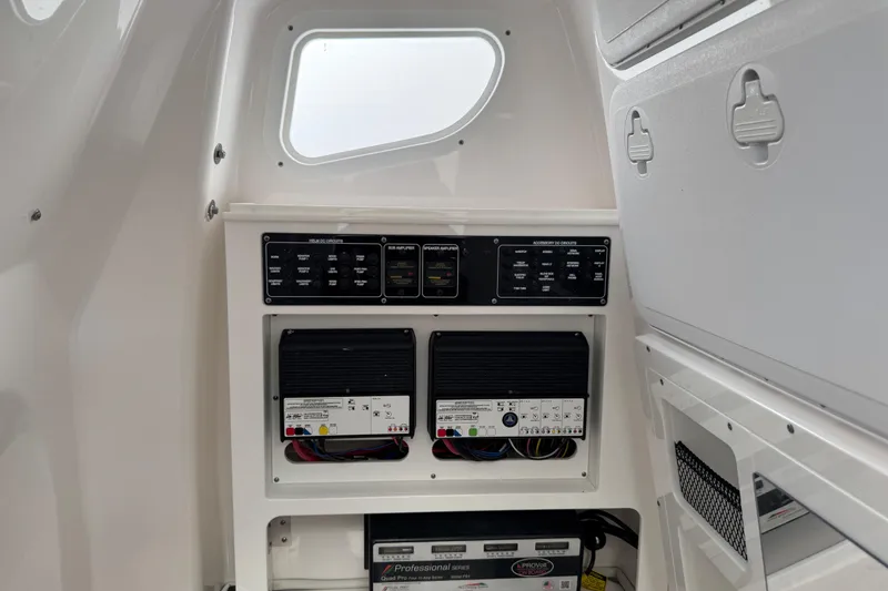 Slide: The Image of 2025 Sea Fox 288 Commander electrical panel with circuit breakers and wiring. - 91