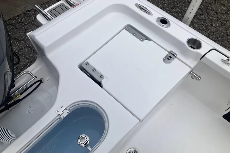 Slide: The Image of Tidewater 1910 Bay Max 2026 boat deck with storage compartments and cup holders. - 13