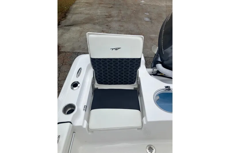 Slide: The Image of 2026 Tidewater 1910 Bay Max boat seat with cup holders and storage compartment. - 15
