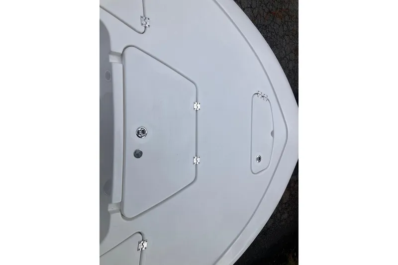 Slide: The Image of Tidewater 1910 Bay Max 2026 boat deck with storage compartments and sleek design. - 18