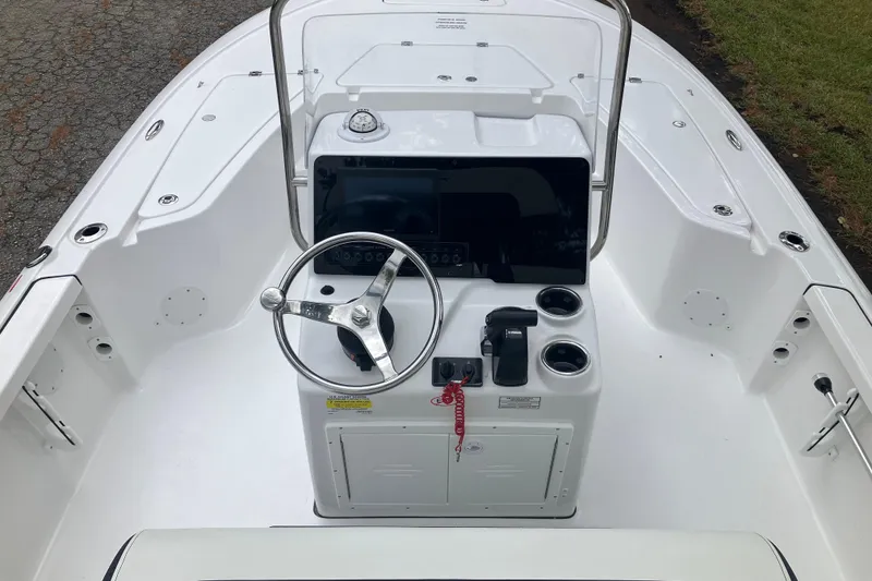 Slide: The Image of 2026 Tidewater 1910 Bay Max boat console with steering wheel and controls. - 22