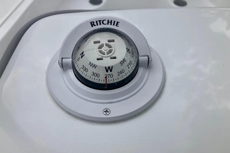 Slide: The Image of Compass on Tidewater 1910 Bay Max boat, model year 2026, showing west direction. - 24