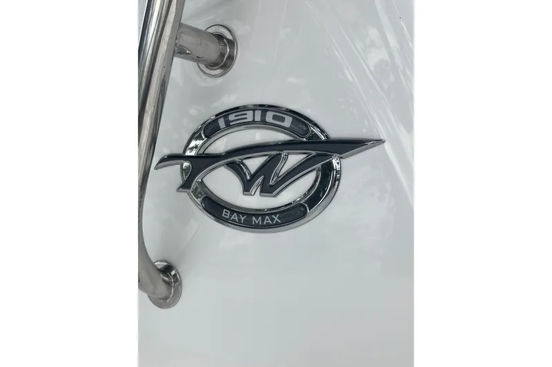 Slide: The Image of 2026 Tidewater 1910 Bay Max logo on white surface with metal railing. - 29