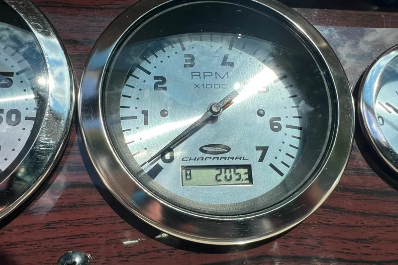 Slide: The Image of Close-up of Chaparral Sunesta 243 2002 RPM gauge displaying 203. - 17