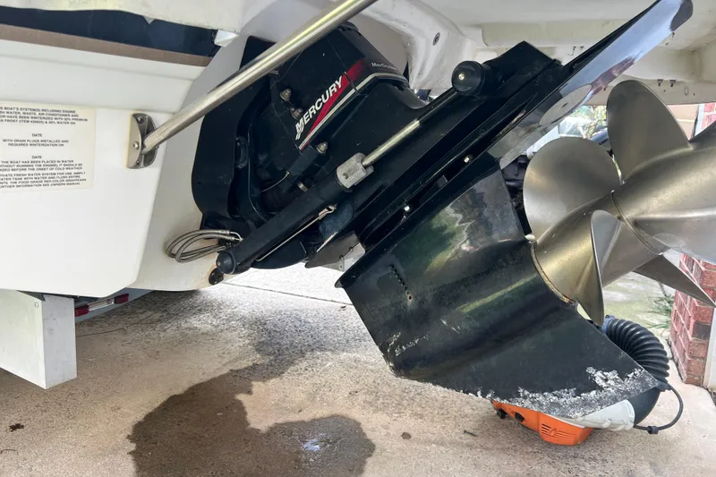 Slide: The Image of Close-up of a 2002 Chaparral Sunesta 243 boat's Mercury outboard motor and propeller. - 2