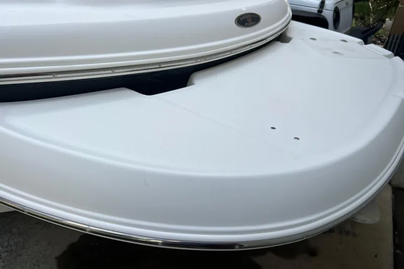Slide: The Image of 2002 Chaparral Sunesta 243 boat's white swim platform detail. - 3