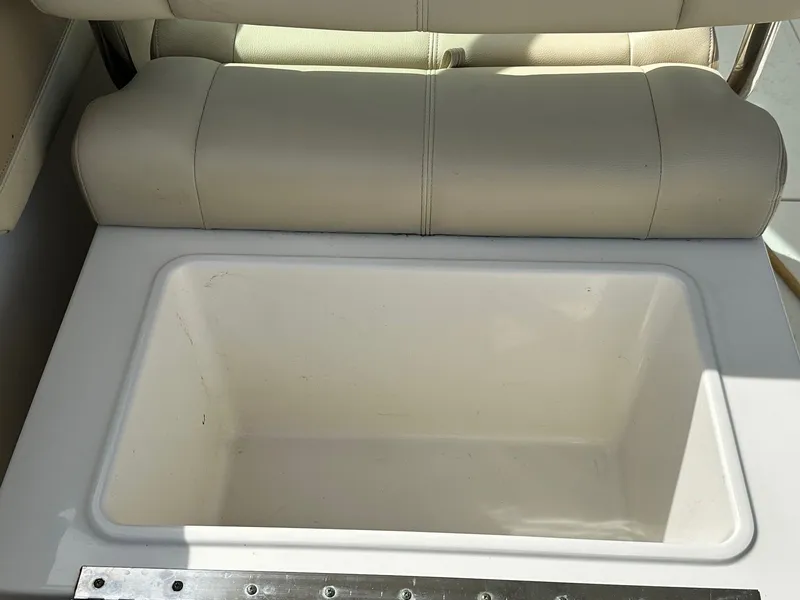 Slide: The Image of 2018 Sailfish 275DC boat seat with built-in storage compartment. - 25