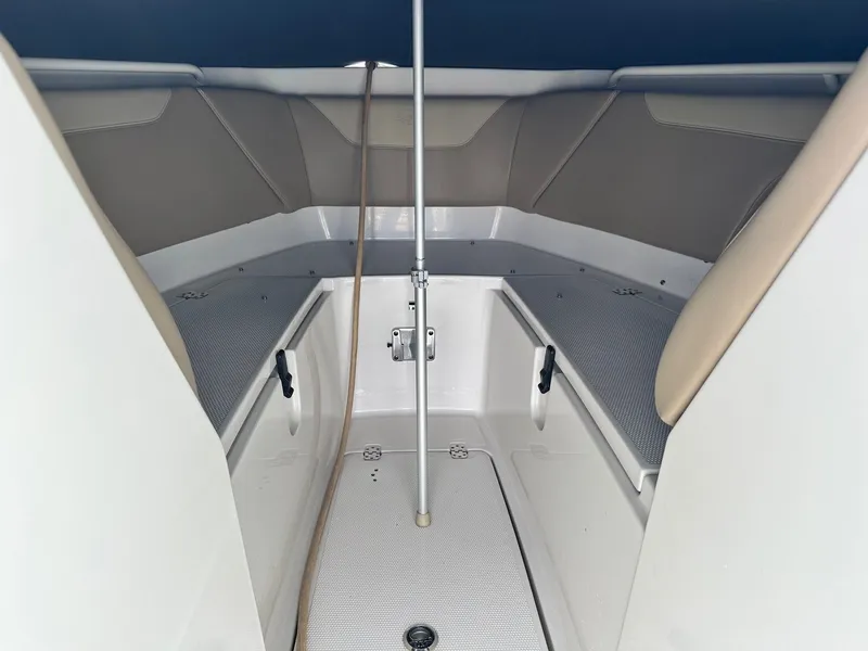 Slide: The Image of 2018 Sailfish 275DC boat interior with seating and storage compartments. - 33